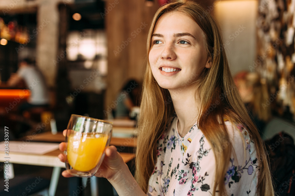 Beautiful girl with Cup in cafe, resting, work break Beautiful girl with Cup in cafe, resting, work break