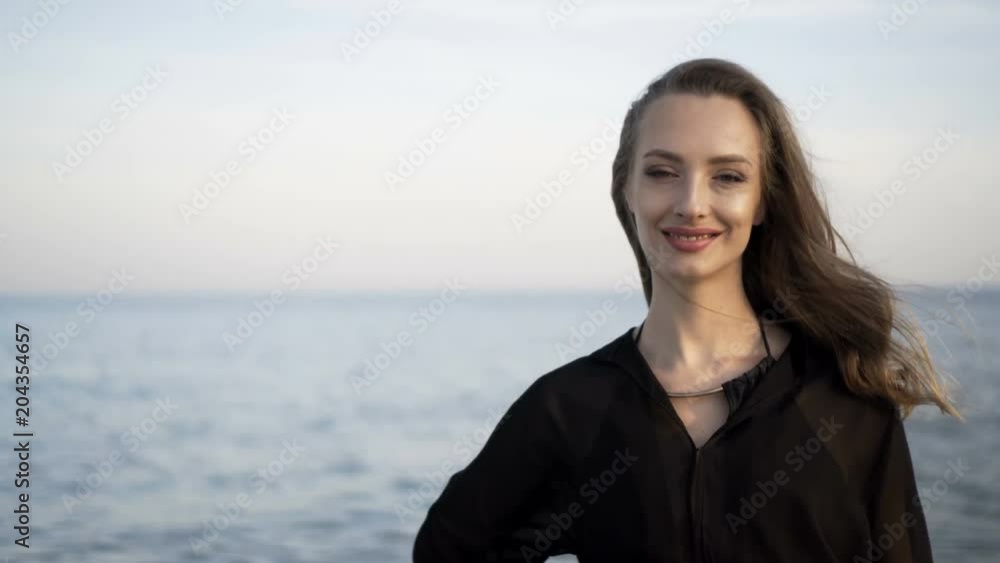 Portrait of beautiful girl on beach at sunset Portrait of beautiful girl on beach at sunset
