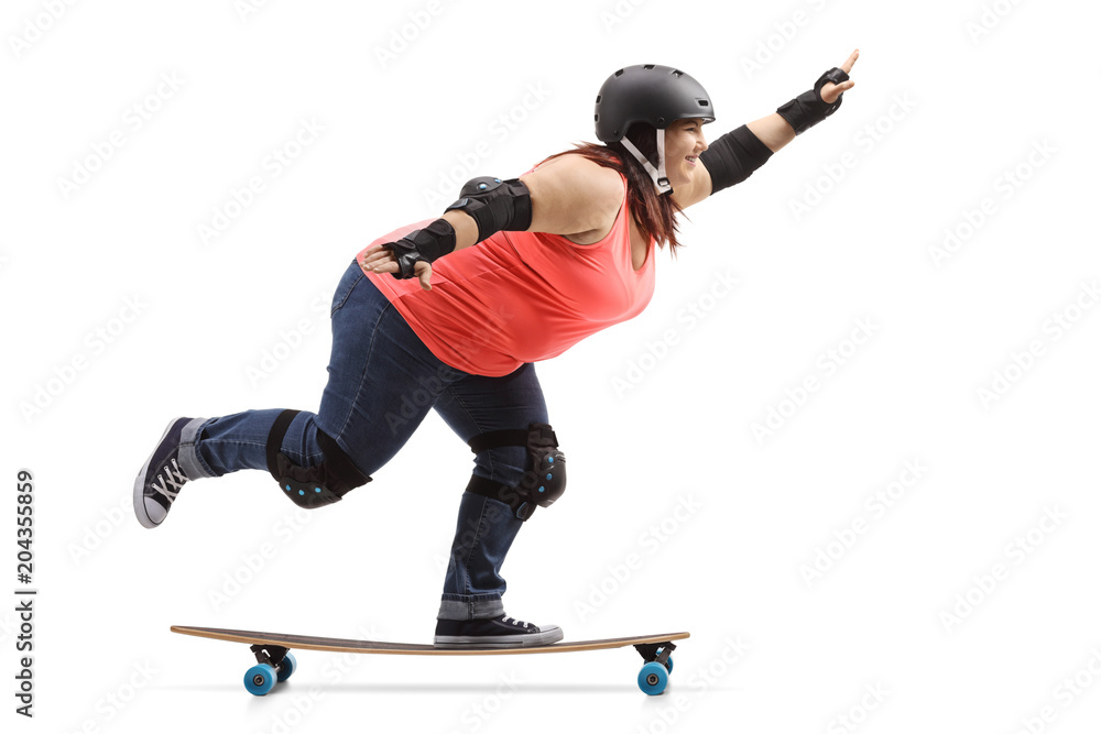 Overweight woman wearing protective gear riding a longboard Overweight woman wearing protective gear riding a longboard