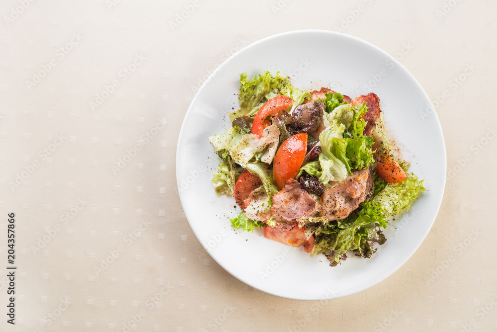 Tasty fresh salad with meat and tomato