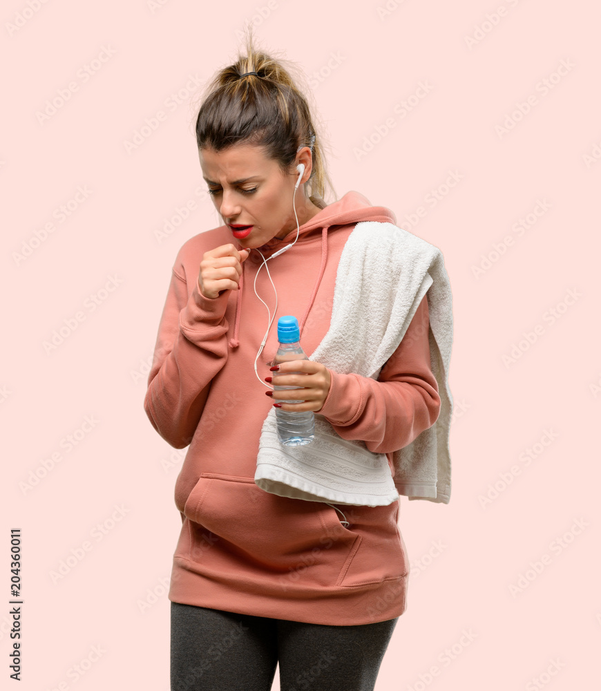 Young sport woman wearing workout sweatshirt sick and coughing, suffering asthma or bronchitis, medicine concept Young sport woman wearing workout sweatshirt sick and coughing, suffering asthma or bronchitis, medicine concept