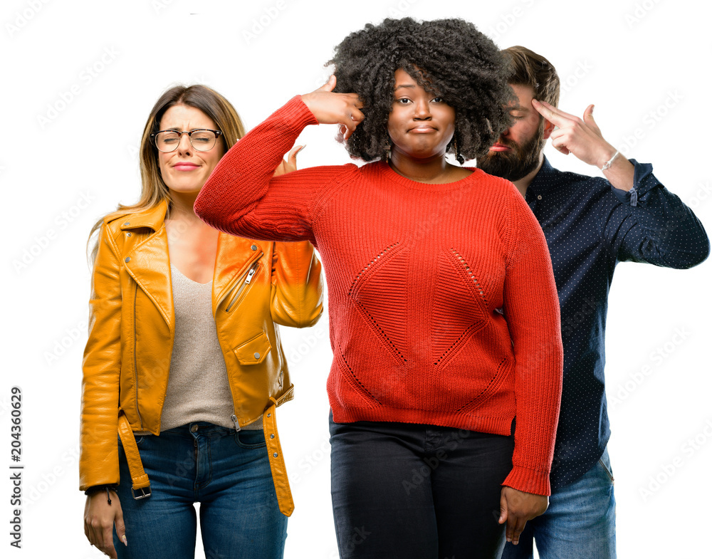 Group of three young men and women unhappy making suicide gesture, tired of everything. Shoots with hand imitating gun, upset Group of three young men and women unhappy making suicide gesture, tired of everything. Shoots with hand imitating gun, upset