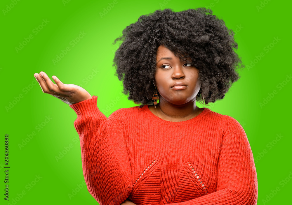 Beautiful african woman irritated and angry expressing negative emotion, annoyed with someone Beautiful african woman irritated and angry expressing negative emotion, annoyed with someone