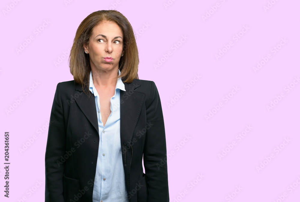 Middle age business woman confident and happy with a big natural smile laughing Middle age business woman confident and happy with a big natural smile laughing
