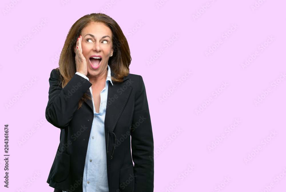 Middle age business woman so happy and confident showing a big smile surprised finger Middle age business woman so happy and confident showing a big smile surprised finger
