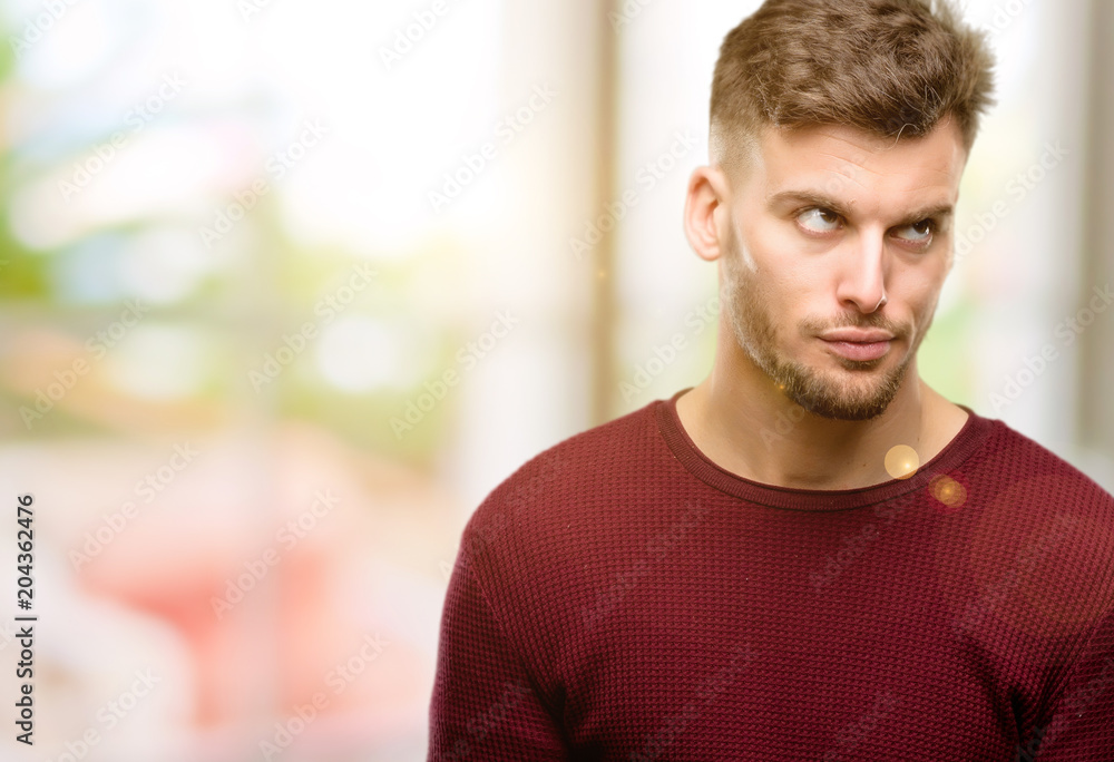 Handsome young man making funny face fooling Handsome young man making funny face fooling