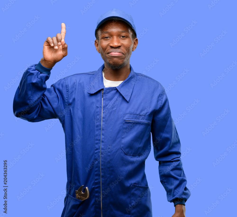 African black plumber man raising finger, the number one African black plumber man raising finger, the number one