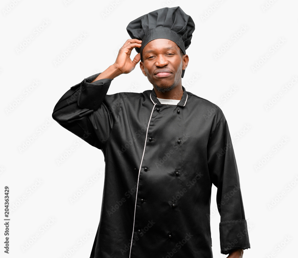 Young black cook wearing chef hat doubt expression, confuse and wonder concept, uncertain future Young black cook wearing chef hat doubt expression, confuse and wonder concept, uncertain future