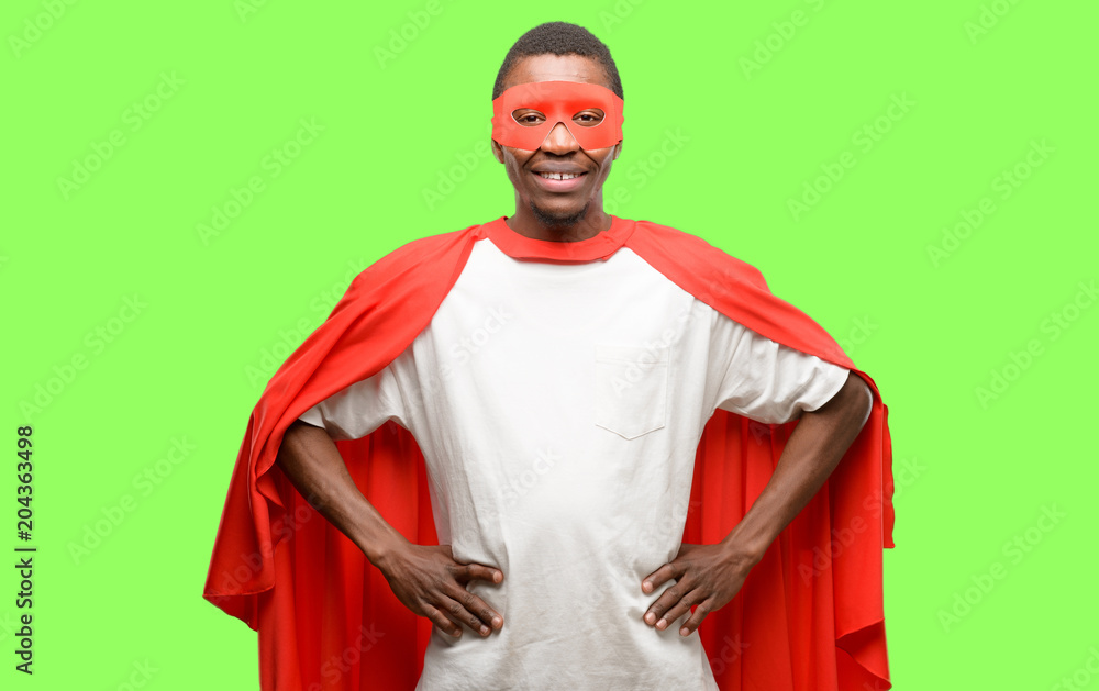 African black super hero man confident and happy with a big natural smile laughing African black super hero man confident and happy with a big natural smile laughing