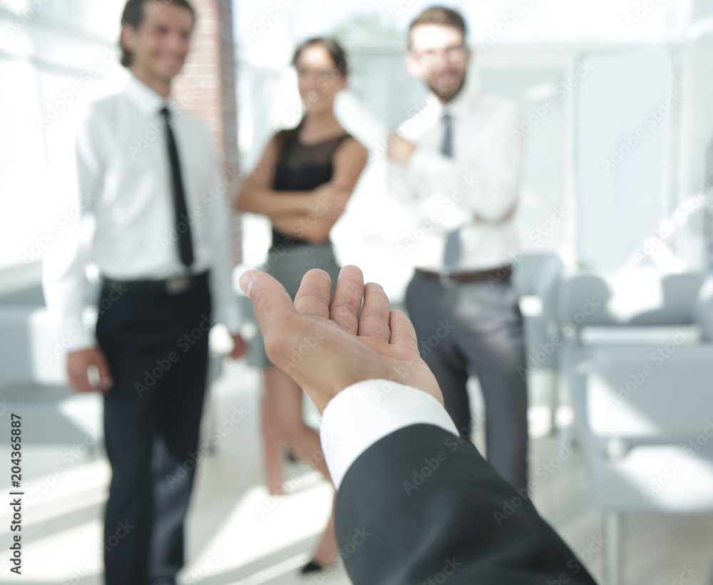 closeup. businessman holding out hand for a handshake. closeup. businessman holding out hand for a handshake.