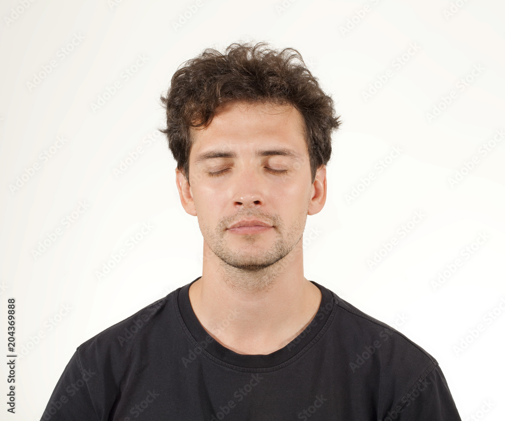 Fototapeta premium Young brunnette man closing his eyes