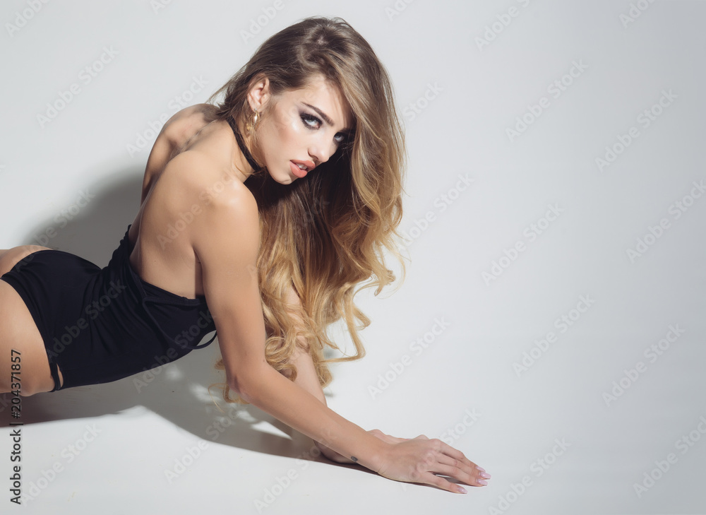 Fashion model with beautiful look. Hairdresser salon and hair care. Makeup and cosmetics for skincare of sexy girl. Beauty and style. Woman with long healthy hair on grey, copy space Fashion model with beautiful look. Hairdresser salon and hair care. Makeup and cosmetics for skincare of sexy girl. Beauty and style. Woman with long healthy hair on grey, copy space