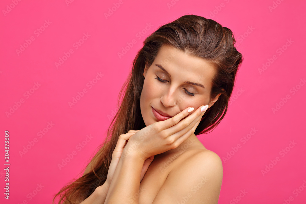 Beautiful woman posing against pink background Beautiful woman posing against pink background
