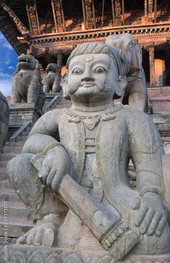 Statues at famous Nyatapola Temple at Durbar square in Bhaktapur, Kathmandu valley, Nepal