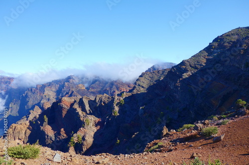 Hiking trail GR131 Rute de los Volcanes leading on the edge of Caldera de Taburiente which is the largest erosion crater in the world, La Palma, Canary Islands, Spain photo