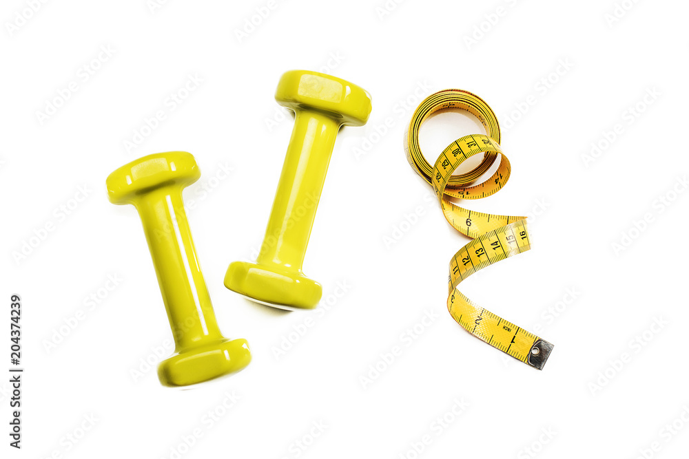 Sport dumbbells with tape measure on white background Sport dumbbells with tape measure on white background