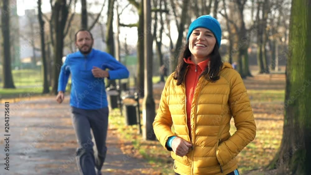 Portrait of happy female jogger in autumn park
Portrait of happy female jogger in autumn park