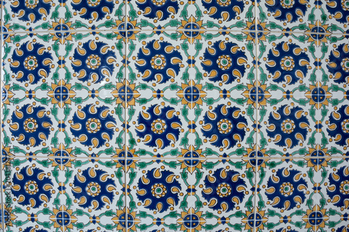 The texture of the old ceramic tile with oriental ornament. Abstract background for design.