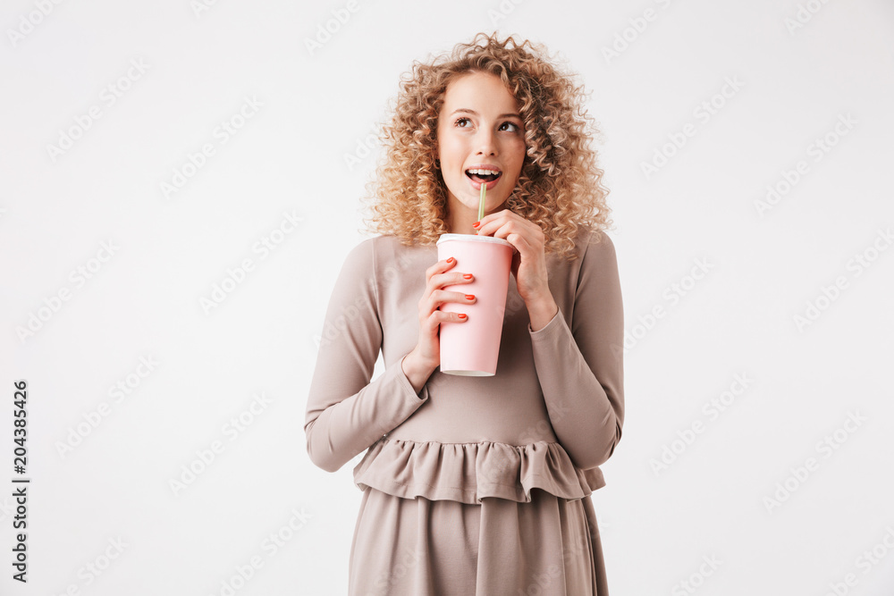 Portrait of a cheerful young curly blonde girl in dress Portrait of a cheerful young curly blonde girl in dress