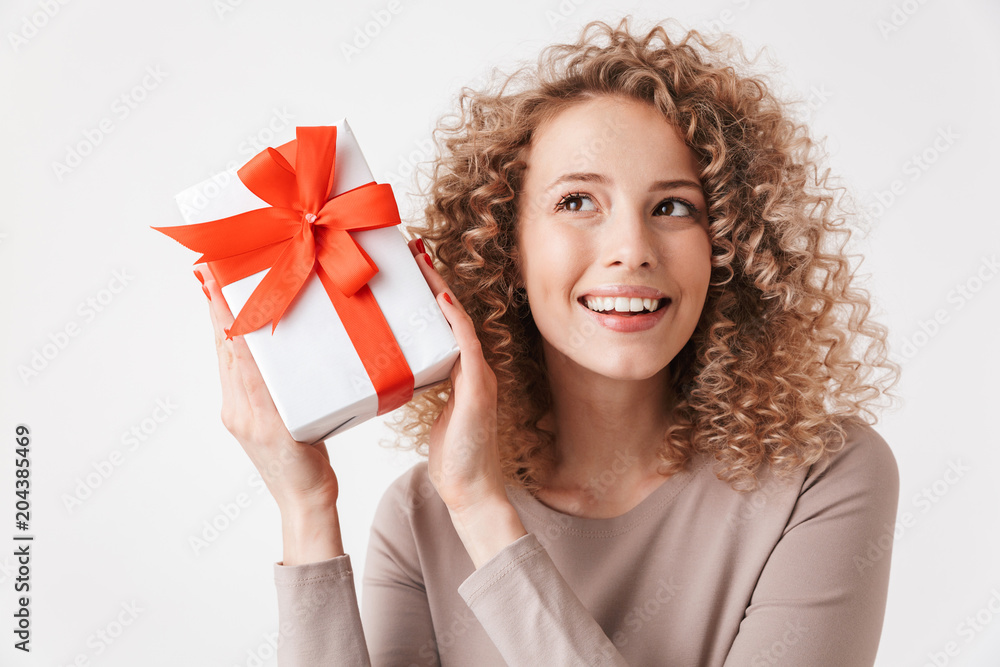 Portrait of a cheerful young curly blonde girl in dress Portrait of a cheerful young curly blonde girl in dress