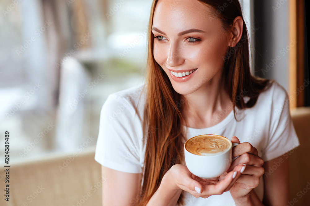Girl in cafe with capuccino Girl in cafe with capuccino