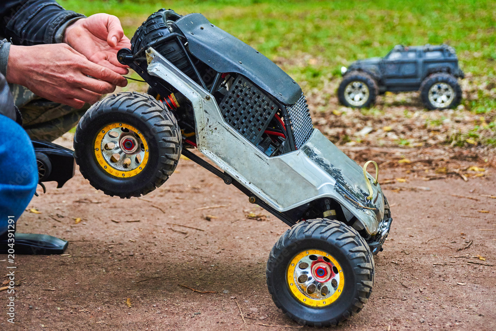 Man is holding Radio-controlled car Man is holding Radio-controlled car