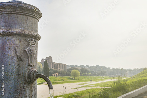 close-up view of a roman Nasone public drinking water fountain photo