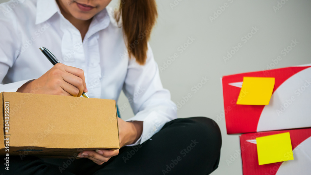 Start up owner small business with many parcel package are Writing customer Address before shipping with Check list paper at workplace online Selling concept. Start up owner small business with many parcel package are Writing customer Address before shipping with Check list paper at workplace online Selling concept.