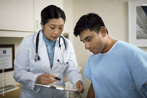 Female doctor consulting with a patient after a medical examination in her office.