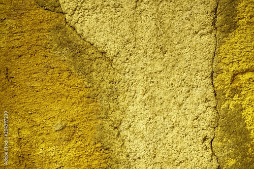 Ultra yellow Plaster concrete texture, stone surface, rock cracked background for postcard