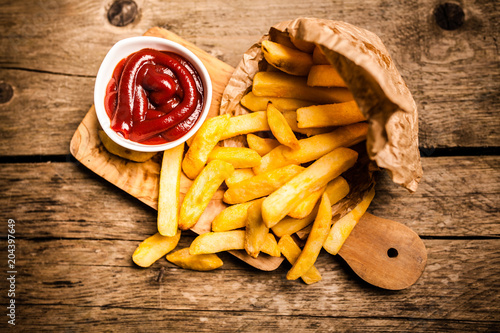 French fries on wooden table