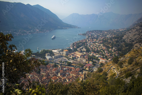 The Scenic landscape of Old City of Kotor, Montenegro. Includes  Venetian architecture, picturesque mountains, Adriatic sea. Popular tourist destination. View from medieval city walls on Mount Lovcen.