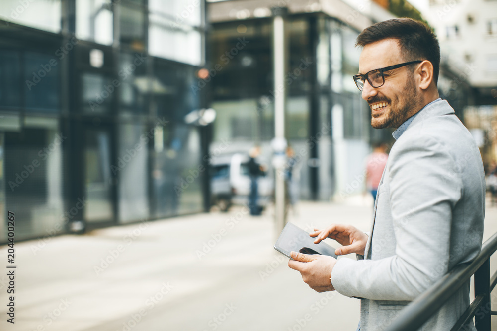 Portrait of a young businessman holding digital tablet Portrait of a young businessman holding digital tablet
