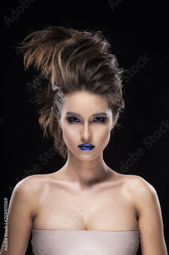 Portrait of a beautiful big breast asian naked shoulders, vanguard conceptual hairstyle and aggressive blue lips makeup girl