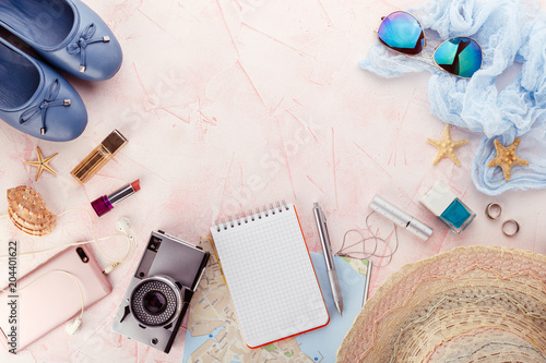 Accessories of traveler on pink background © Irina Burakova