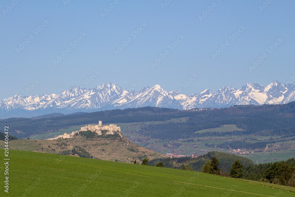 Spis castle and High Tatras National park in the background Spis castle and High Tatras National park in the background