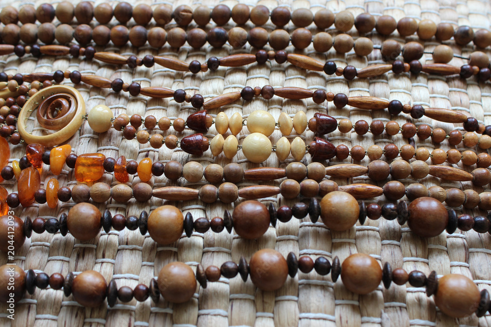 Obraz premium Wooden beads of different size and color