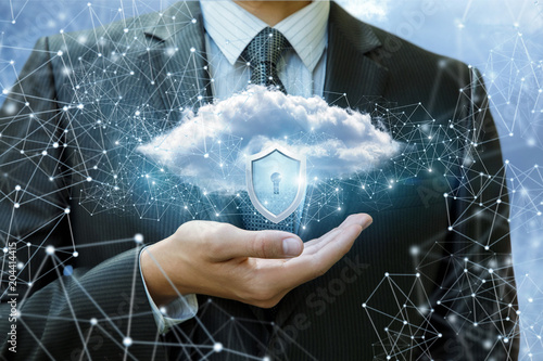 Data cloud with a protective shield in the hand.