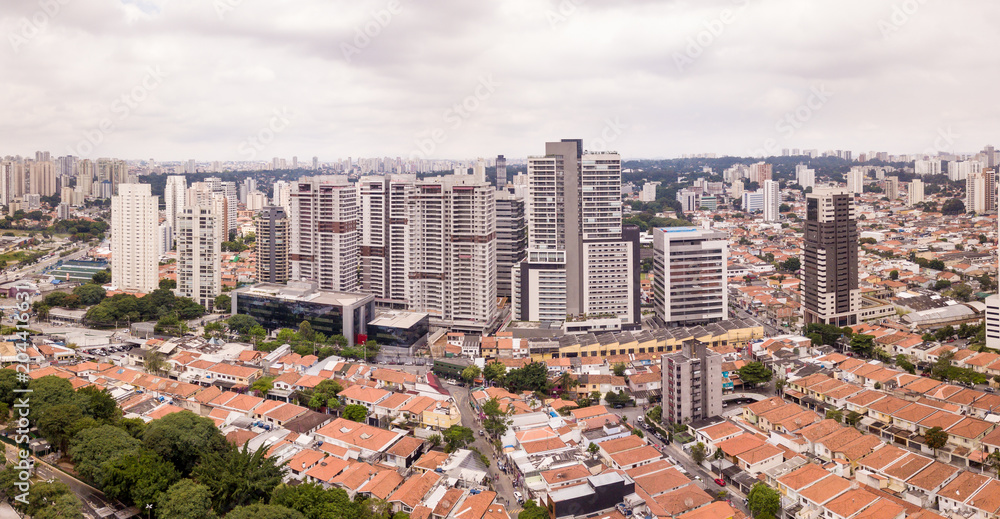 Aerial view of Sao Paulo with buildings and houses on cloudy winter day. Aerial view of Sao Paulo with buildings and houses on cloudy winter day.