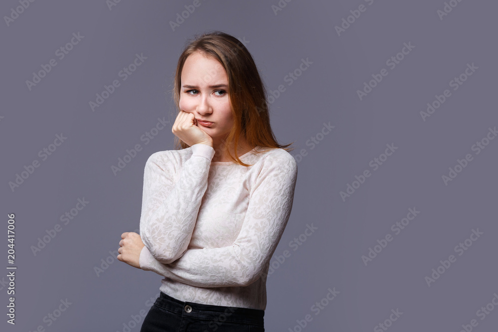 The girl frowned. He looks anxiously at the chin in his hand The girl frowned. He looks anxiously at the chin in his hand