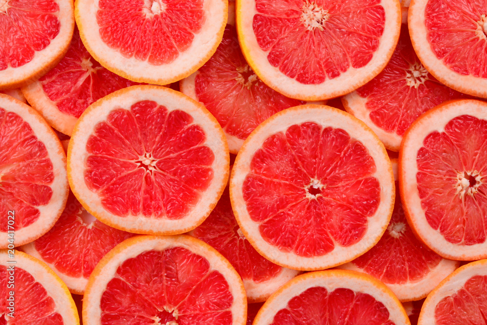 Grapefruit red juicy slices background. top view Grapefruit red juicy slices background. top view
