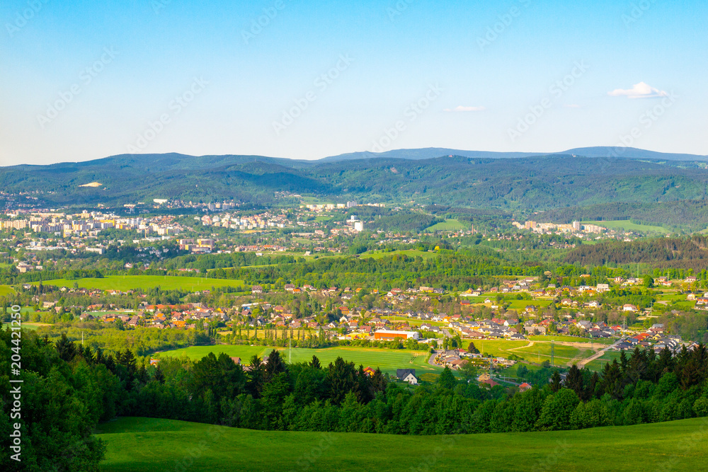 Liberec City Panorama with Jizera Mountains on the background, Czech Republic. Sunny spring day.