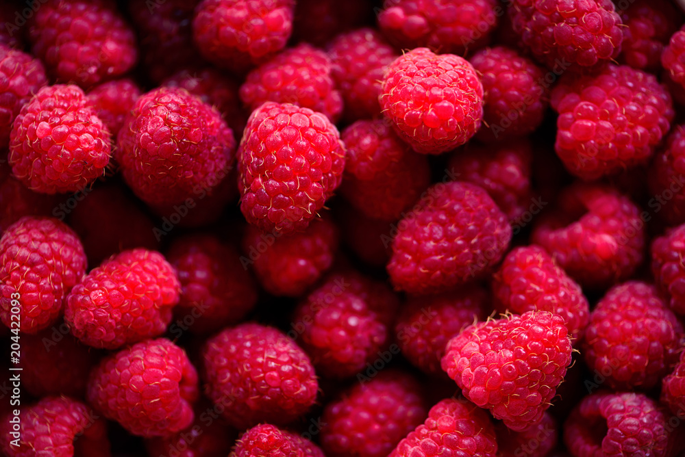 Fresh raspberries background with copy space. Top view, close up. Summer, vitamin, vegan, vegetarian concept. Healthy food. Macro of berries Fresh raspberries background with copy space. Top view, close up. Summer, vitamin, vegan, vegetarian concept. Healthy food. Macro of berries