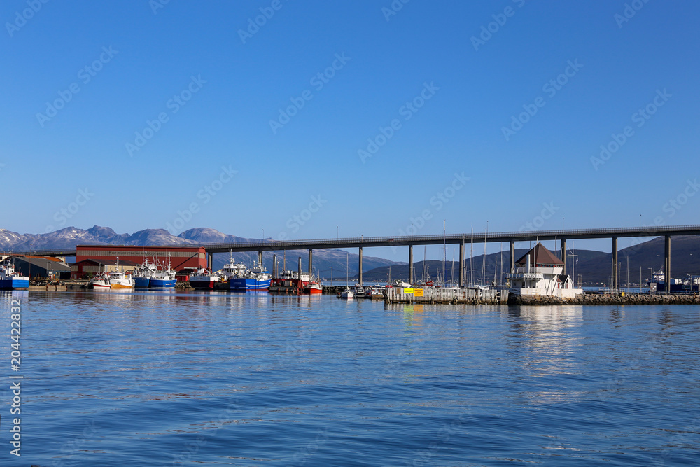 Bridge and fishing harbor in Tromso Northern Norway