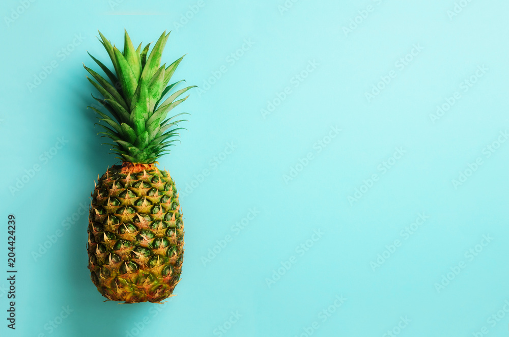Pineapple on blue background. Top View. Copy Space. Pattern for minimal style. Pop art design, creative concept