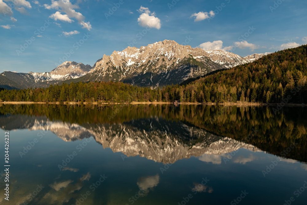 Great reflections of the Kampenwand at Lautersee on sunset