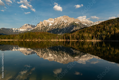 Great reflections of the Kampenwand at Lautersee on sunset