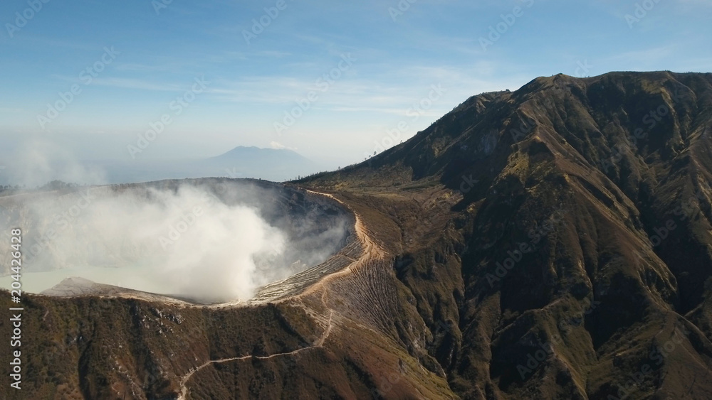 Crater with acidic crater lake, Kawah Ijen the famous tourist attraction, where sulfur is mined. Aerial view of Ijen volcano complex is a group of stratovolcanoes in the Banyuwangi Regency of East
