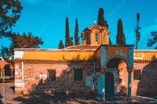 beautiful small church in the top of thessaloniki with afternoon sunlight photo