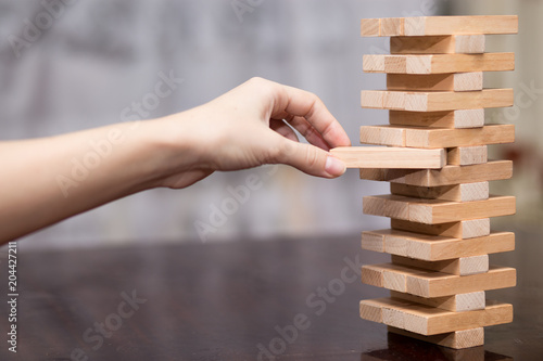 Obraz na plátne The tower from wooden blocks, Businesswoman Building Up Tower, Challenge In Busi